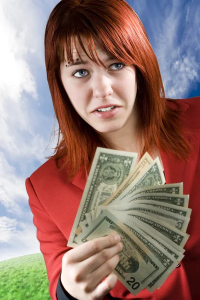Chica sorprendida agitando dólares americanos — Foto de Stock