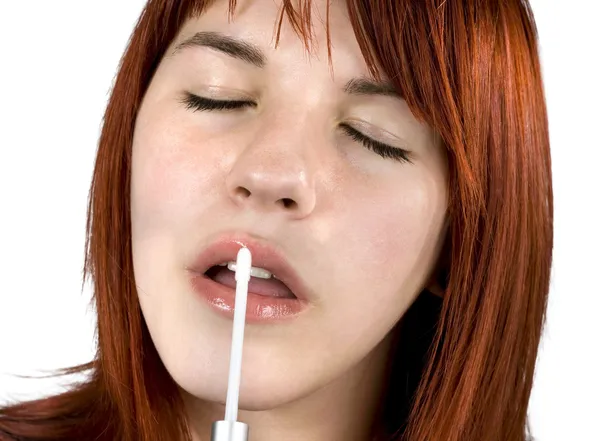 Close-up of a cute redhead applying lipstick shi — Stock Photo, Image