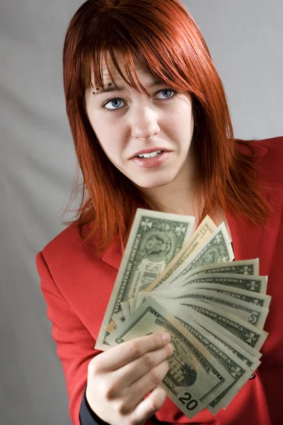 Menina surpreso acenando dólares americanos — Fotografia de Stock