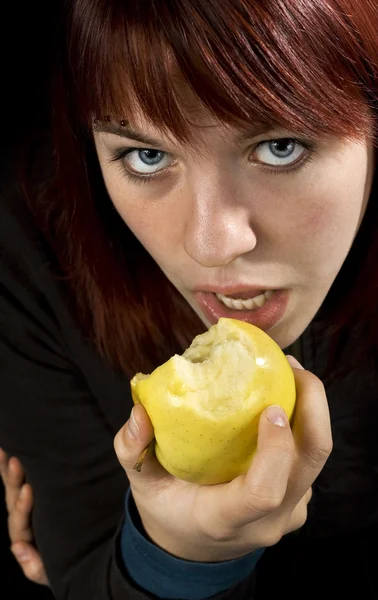 stock image Seductive girl eating apple