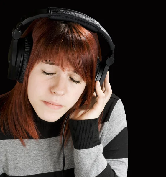 Menina pensativa ouvindo música — Fotografia de Stock