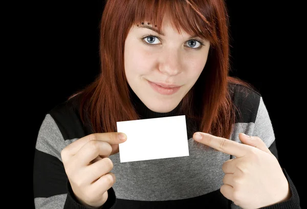 Girl pointing at a blank business card Royalty Free Stock Photos