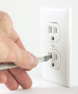 Craft knife in electrical outlet clipart