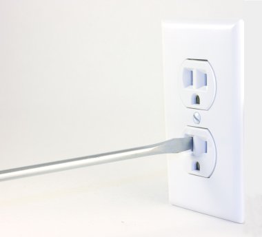 A screwdriver going into an outlet clipart