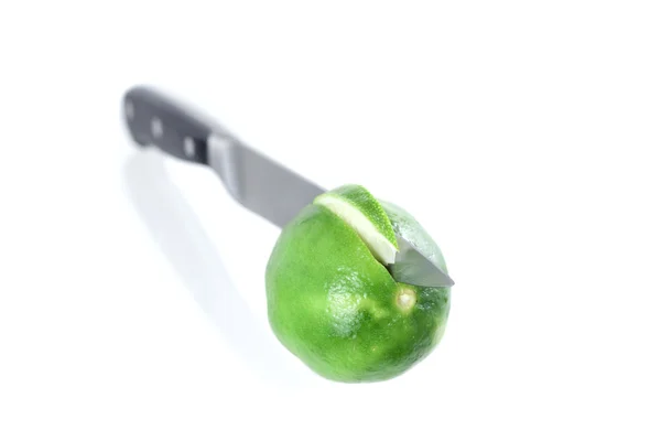 stock image A lime section cut by a chefs knife