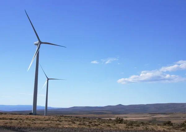 stock image Two windmills on a mountain side