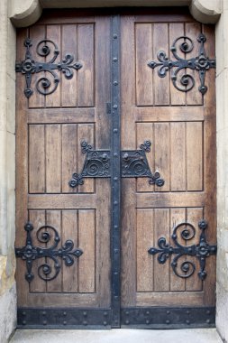 Wooden door with iron details clipart