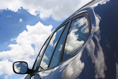Clouds in the new car. clipart