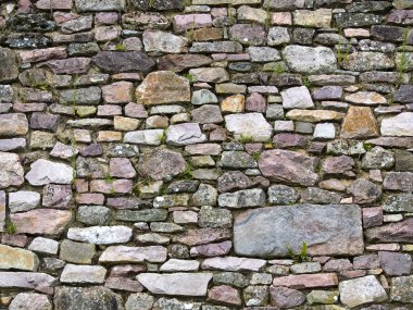 Old wall of stones of a medieval castle clipart