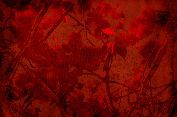 Текстурированный красный фон с листьями и ветвями - скрапбукинг — стоковое фото