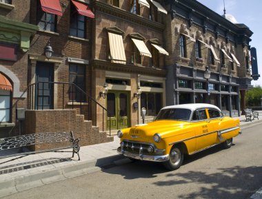 Old American Taxi in a old town clipart