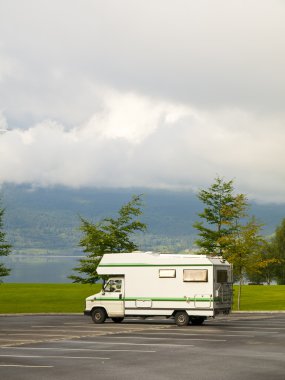 Autocaravan in the Vangsvatnet clipart