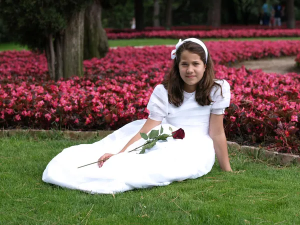 Girl posing with her first communion dress — Stock Photo, Image