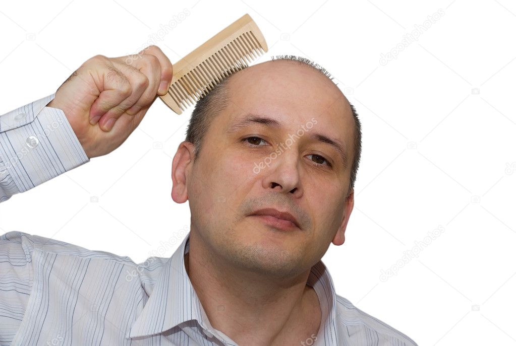 Bald man combs hair