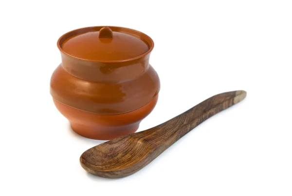 Pot and wooden spoon — Stock Photo, Image