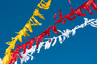 Celebratory colour tapes on a carnival, garlands. clipart