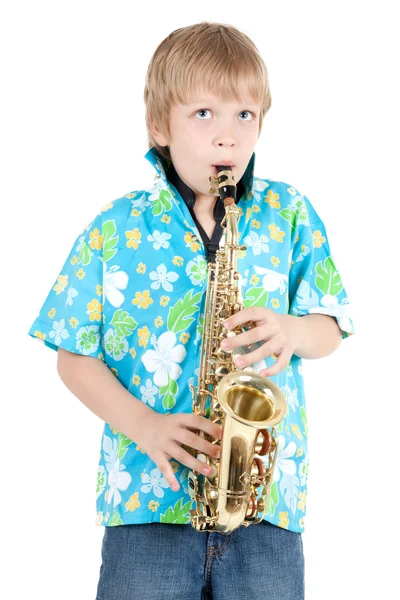 Chlapec hraje saxofon — Stock fotografie