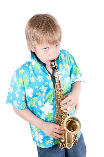 Chlapec hraje saxofon — Stock fotografie
