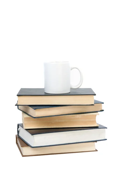Tasse auf einem Buch — Stockfoto