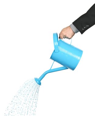 Hand pouring water from watering can clipart