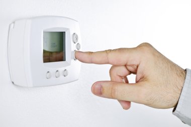 Hand setting digital thermostat clipart