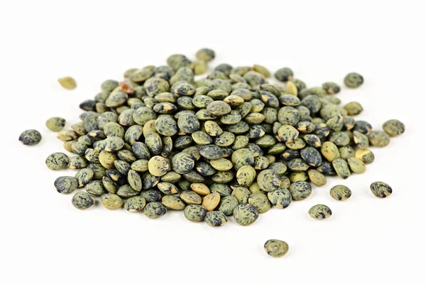 Pile of uncooked French lentils — Stock Photo, Image