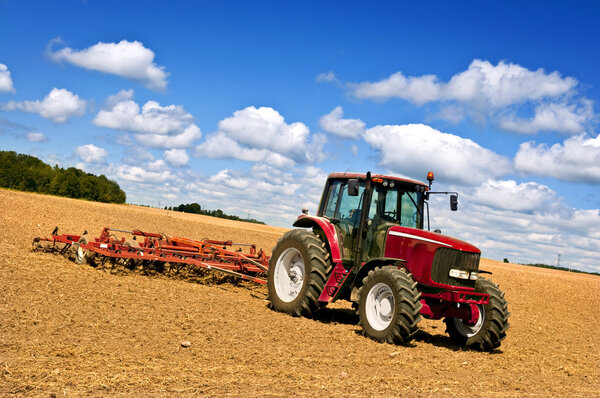 Tractor in plowed field