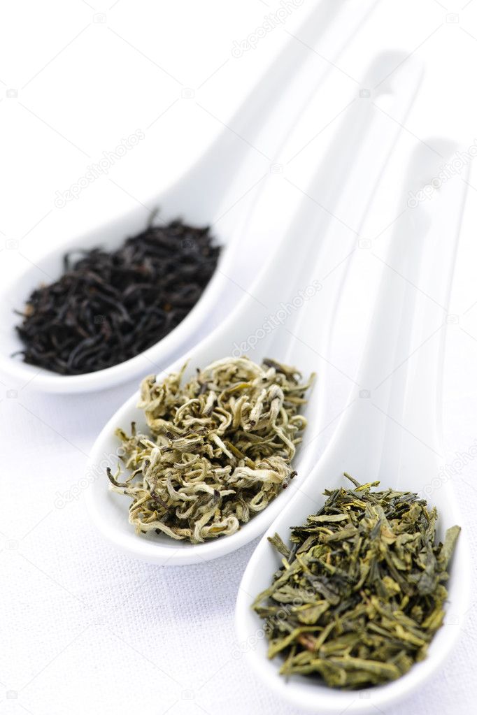 Assortment of dry tea leaves in spoons
