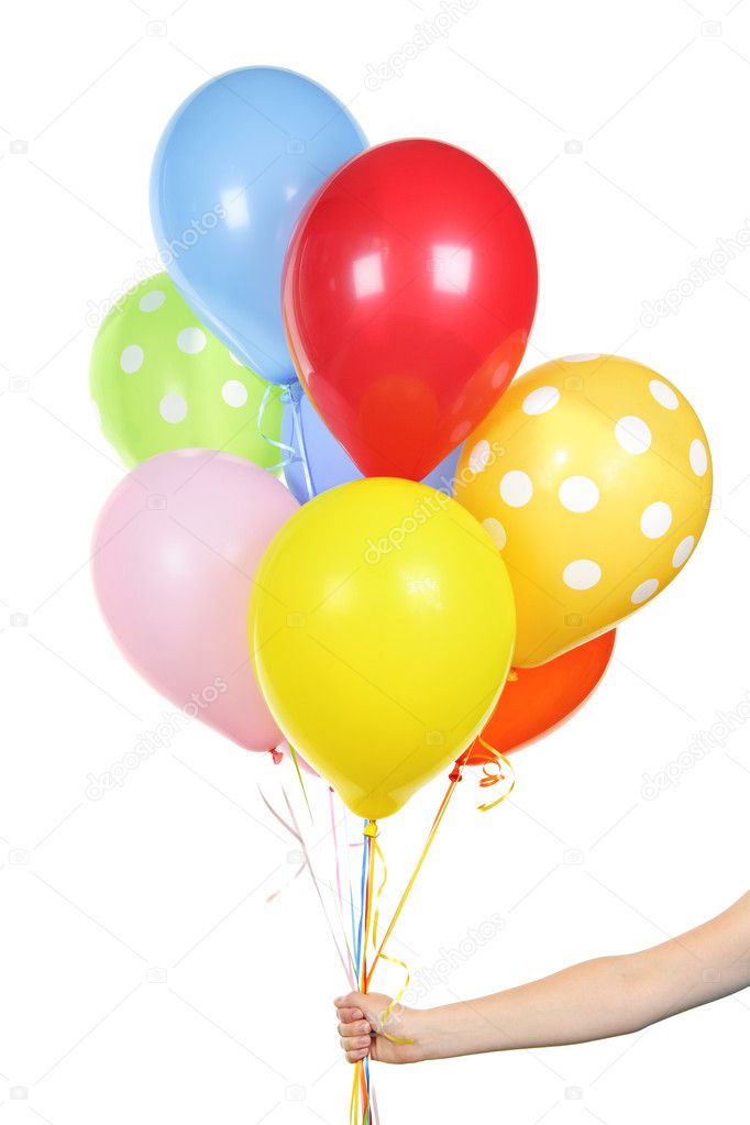 Hand holding balloons on white