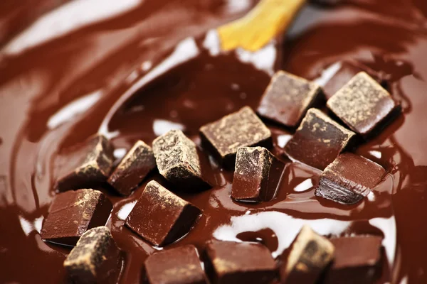 Derreter chocolate e colher — Fotografia de Stock