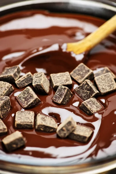 Melting chocolate and spoon — Stock Photo, Image