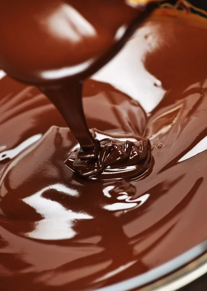 Melted chocolate and spoon — Stock Photo, Image