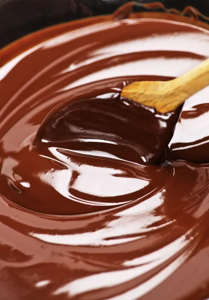 Chocolate derretido e colher — Fotografia de Stock