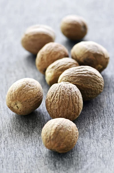 Whole nutmeg seeds — Stock Photo, Image