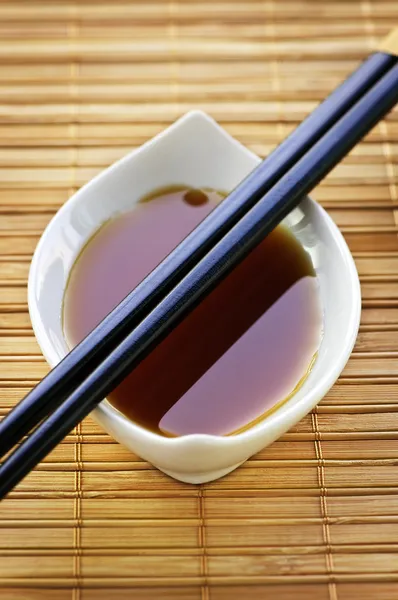 Soy sauce with chopsticks — Stock Photo, Image