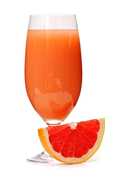 Grapefruit juice in glass — Stock Photo, Image