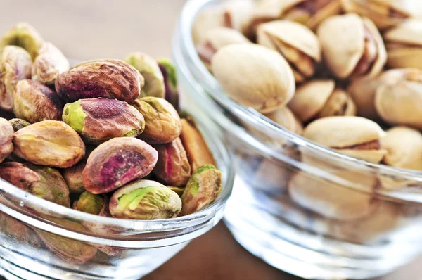 Pistachio nuts in glass bowls — Stock Photo, Image