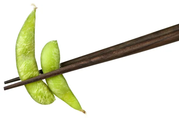 Soy beans with chopsticks — Stock Photo, Image