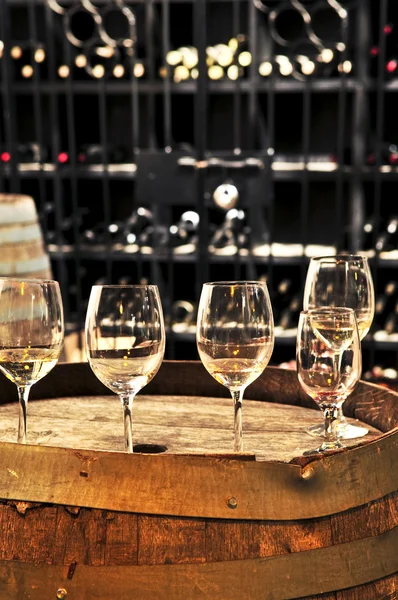 Wine glasses and barrels — Stock Photo, Image