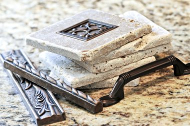 Ceramic tiles and borders for backsplash close up on a granite surface clipart