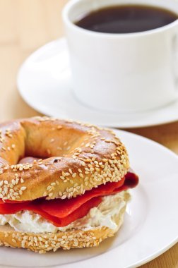 Light meal of smoked salmon bagel and coffee clipart