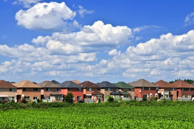 Row of residential houses in suburban neighborhood clipart