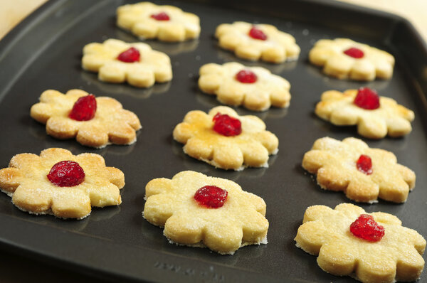 Fresh shortbread cookies on a baking tray