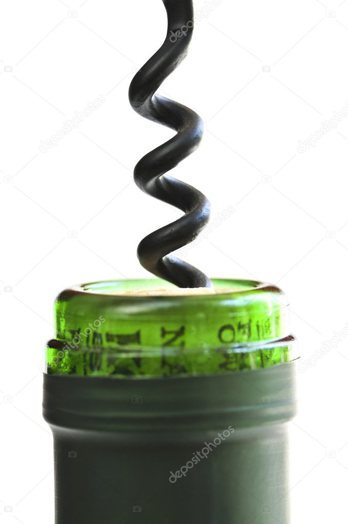 Opening wine bottle with a corkscrew on white background