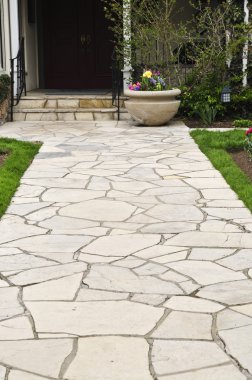 Natural stone path leading to a house, landscaping element clipart