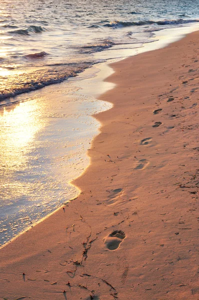 Tropical beach with footprints — Stock Photo, Image
