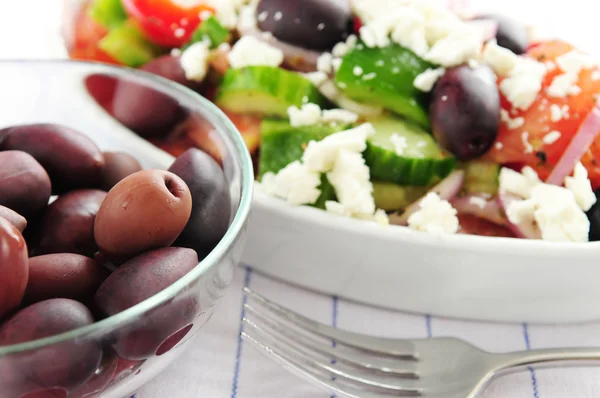 Olives and greek salad — Stock Photo, Image