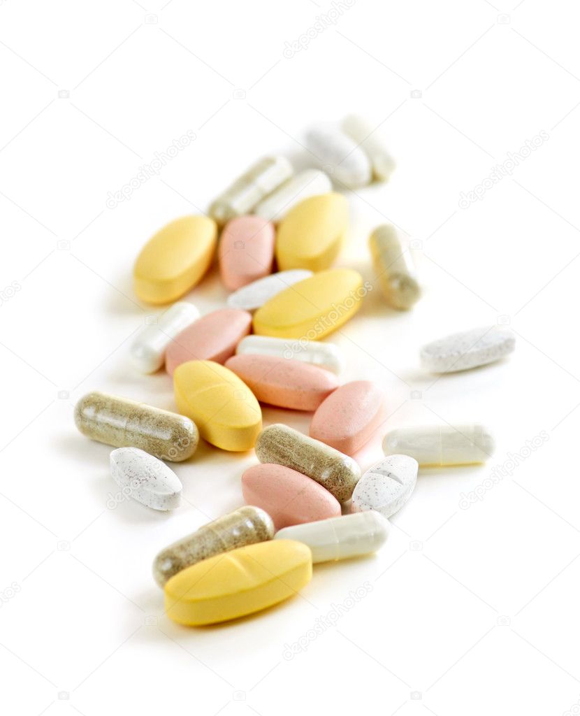 Mix of vitamins and herbal supplements on white background