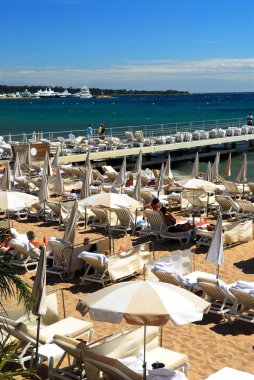 View on the beach from Croisette promenade in Cannes, France clipart