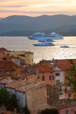 Cruise ships at St.Tropez at sunset in French Riviera clipart